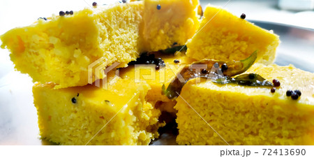Closup shot of gujarati Khaman Dhokla or Steamed Gram Flour Snack Closup shot of gujarati Khaman Dhokla or Steamed Gram Flour Snack 72413690