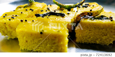 Closup shot of gujarati Khaman Dhokla or Steamed Gram Flour Snack Closup shot of gujarati Khaman Dhokla or Steamed Gram Flour Snack 72413692