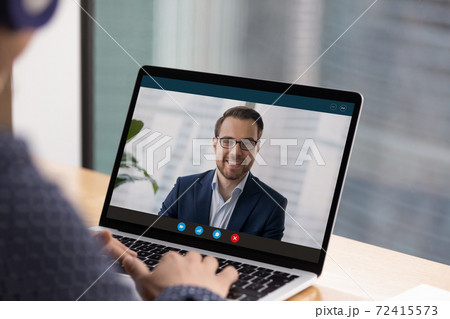 Employee talk on video call with male colleague 72415573
