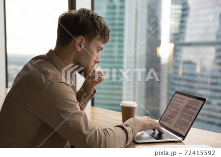 Pensive young man work on laptop thinking Pensive young man work on laptop thinking 72415592