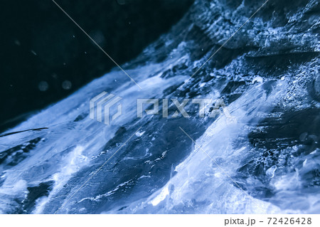 Pattern of crack in ice. Frozen water textured background 72426428