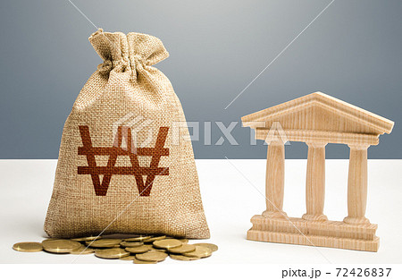South korean won money bag and bank / government building. Budgeting, national financial system. Lending loans, deposits. Monetary policy. Resource allocation. Support businesses in crisis. South korean won money bag and bank / government building. Budgeting, national financial system. Lending loans, deposits. Monetary policy. Resource allocation. Support businesses in crisis. 72426837