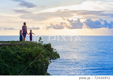 Happy children with mother have fun on summer beach holiday Happy children with mother have fun on summer beach holiday 72426952