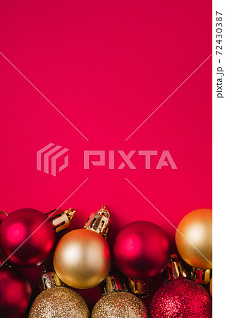 Christmas composition. Purple and golden ornament and bauble decorations. Copy space Christmas composition. Purple and golden ornament and bauble decorations. Copy space 72430387