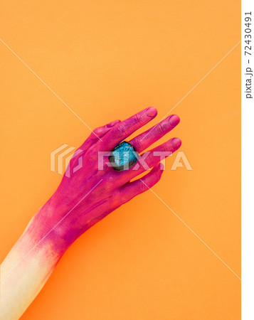 Body paint or art makeup on marigold background. 72430491
