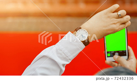 Man's hands shooting with phone empty green screen red carpet Man's hands shooting with phone empty green screen red carpet 72432336