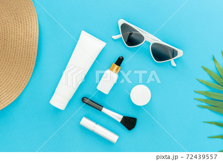 White bottle cream, mockup of beauty product brand. Top view on the blue background. White bottle cream, mockup of beauty product brand. Top view on the blue background. 72439557