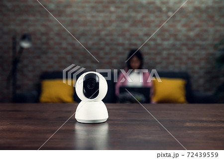 Security CCTV camera, surveillance technology on the table and blur background. Security CCTV camera, surveillance technology on the table and blur background. 72439559