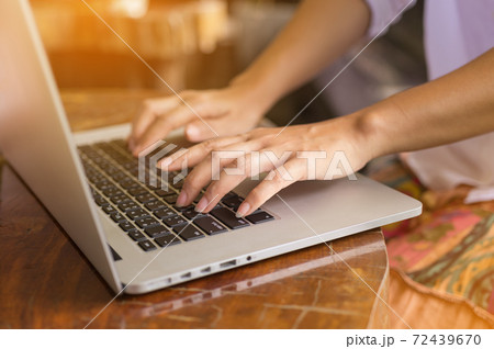 Hand on laptop. 72439670