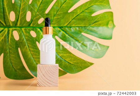 White bottle cream, mockup of beauty product brand on the orange background. 72442003
