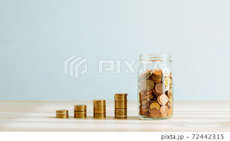 Plant on pile coins in the bottle, Money growing concept and the goal success. Plant on pile coins in the bottle, Money growing concept and the goal success. 72442315