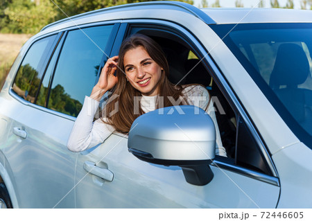 the girl in the car looking out the window 72446605