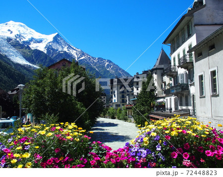 CHAMONIX MONT BLANC village with high alpine mountains range landscape in european french ALPS with colorful flowers at Arve river in FRANCE with clear blue sky in 2016 warm sunny summer day on July. 72448823