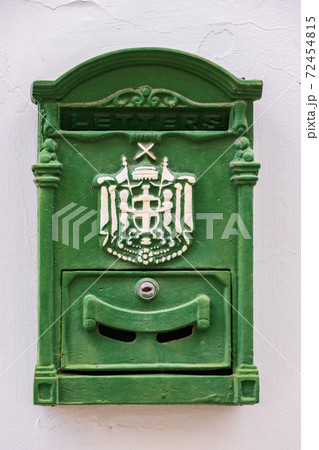 Green metal antique mailbox on a white house wall in old NIcosia, Cyprus Green metal antique mailbox on a white house wall in old NIcosia, Cyprus 72454815