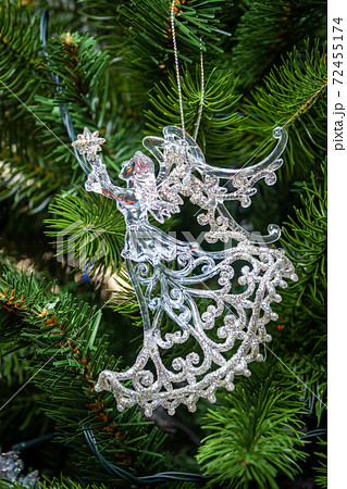 Russia. Saint-Petersburg. Christmas tree decoration in the form of a transparent glowing angel. Russia. Saint-Petersburg. Christmas tree decoration in the form of a transparent glowing angel. 72455174