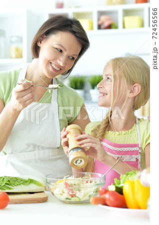 Close up portrait of cute little girl with mother 72456566