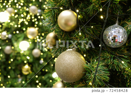 Christmas background of de-focused lights with decorated tree 72458428