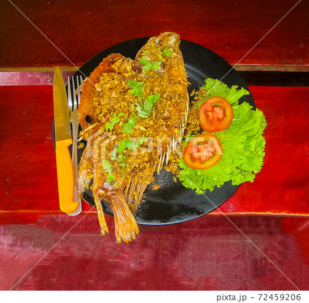 Balinese Jimbaran beach famous for it's perfect sea food restaurants 72459206