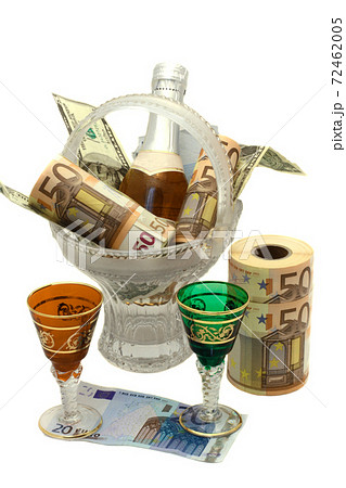 money rolled into a roll, wine, vase and two glasses 72462005