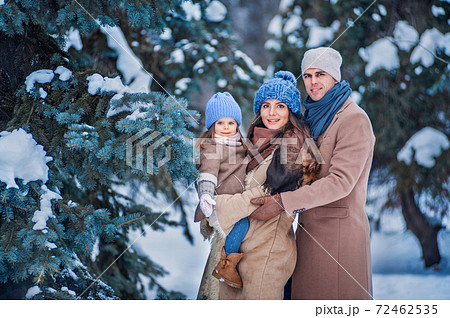 portrait of a family against the background of snow-covered trees portrait of a family against the background of snow-covered trees 72462535