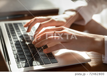 Close up of woman doctor work on computer 72462800
