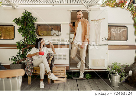 Love couple relaxing in rv, camping in a trailer Love couple relaxing in rv, camping in a trailer 72463524