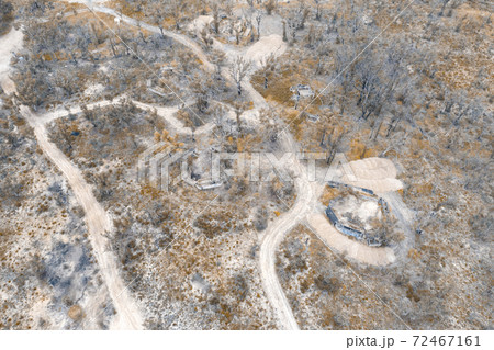 Aerial photograph of structural ruins and forest after bushfires in regional Australia 72467161