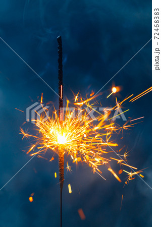 fire sparkler in dense smoke, abstract Christmas firework background fire sparkler in dense smoke, abstract Christmas firework background 72468383