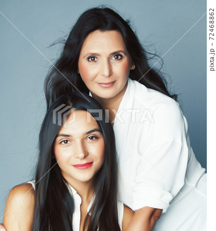 cute pretty teen daughter with mature mother hugging, fashion style brunette, lifestyle people concept cute pretty teen daughter with mature mother hugging, fashion style brunette, lifestyle people concept 72468862