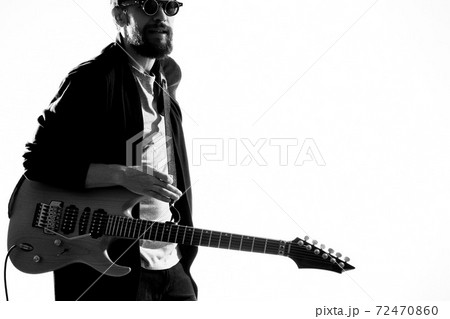 Male musician with guitar rock star performing entertainment program Male musician with guitar rock star performing entertainment program 72470860