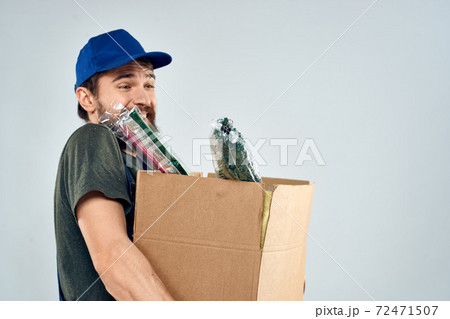 Male worker loading delivery boxes in hands packing lifestyle Male worker loading delivery boxes in hands packing lifestyle 72471507
