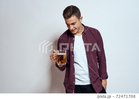 Man with a mug of beer fun alcohol lifestyle shirt light background Man with a mug of beer fun alcohol lifestyle shirt light background 72471708