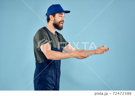 Man in working uniform emotions in life delivery service work Man in working uniform emotions in life delivery service work 72472386