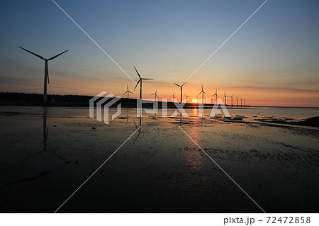 sunset of wind farm at Gaomei Wetland refuge, taiwan 72472858
