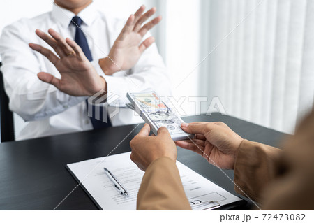 Businessman partner hand gesture rejecting refusing money, anticorruption concept. 72473082