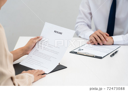 Interview the job and hiring, businessman candidate at job interview explaining about his profile to business manager in modern office space. Business consulting or employment concept. Interview the job and hiring, businessman candidate at job interview explaining about his profile to business manager in modern office space. Business consulting or employment concept. 72473088