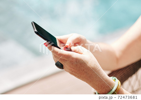 Woman using mobile application 72473681
