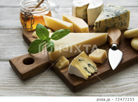 Various types of cheese  on a white wooden  background 72477255