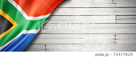 South African flag on old white wall banner 72477629