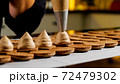 Chef is making caramel macarons, close-up. 72479302