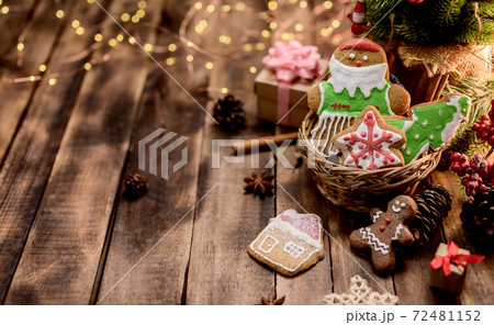 Homemade Xmas cookie for Christmas and Happy New Year. Gingerbread on wood background for winter holiday. 72481152