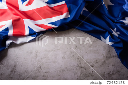 Happy Australia day concept. Australian flag against old stone background. 26 January. Happy Australia day concept. Australian flag against old stone background. 26 January. 72482128