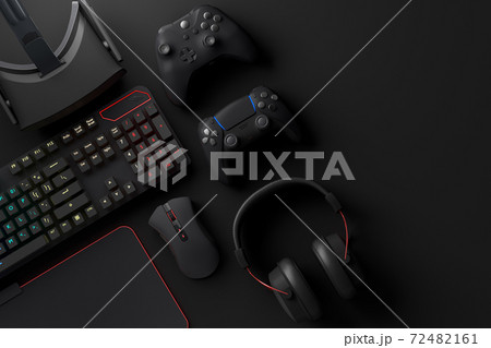 Top view of gamer workspace and gear like mouse, keyboard, joystick, headset, VR 72482161
