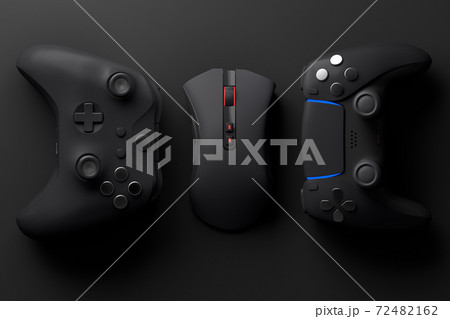 Top view of gamer workspace and gear like mouse, joystick on black table 72482162