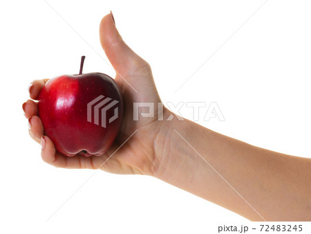 red apple in hand red apple in hand 72483245