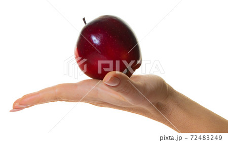 red apple in hand red apple in hand 72483249