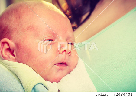 Little newborn baby sleeping calmly in blanket 72484401