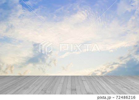 Wooden floor in grey color with blur nature background of blue sky and clouds 72486216