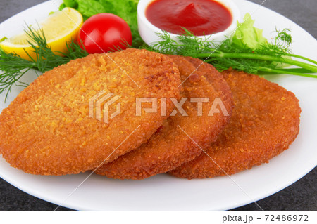 Fish pancakes on plate 72486972