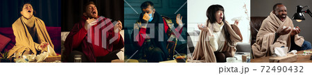 Young people wrapped in a plaid looks sick, ill, sneezing and coughing sitting at home indoors Young people wrapped in a plaid looks sick, ill, sneezing and coughing sitting at home indoors 72490432